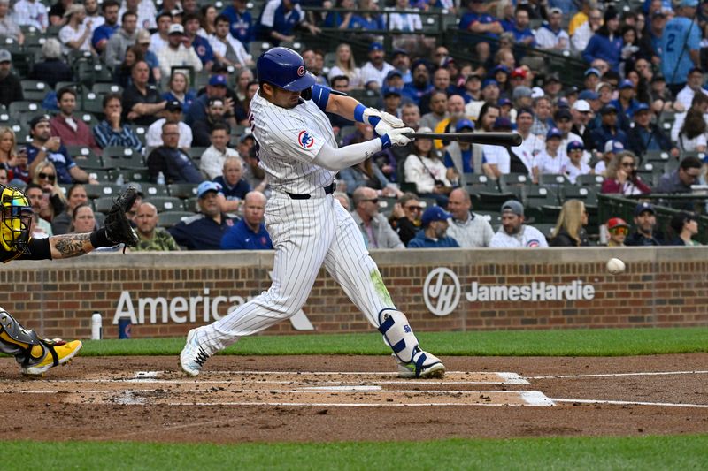 May 16, 2024; Chicago, Illinois, USA;  Chicago Cubs outfielder Seiya Suzuki (27) singles during the first inning against the Pittsburgh Pirates at Wrigley Field. Mandatory Credit: Matt Marton-USA TODAY Sports