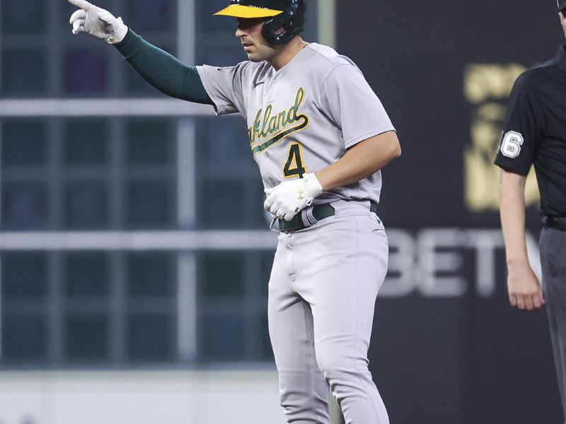 Sep 11, 2023; Houston, Texas, USA; Oakland Athletics third baseman Kevin Smith (4) reacts after hitting a double during the fifth inning against the Houston Astros at Minute Maid Park. Mandatory Credit: Troy Taormina-USA TODAY Sports