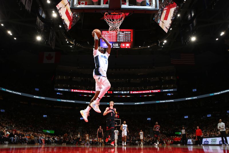 TORONTO, CANADA - JANUARY 3: Kentavious Caldwell-Pope #3 of the Orlando Magic drives to the basket during the game against the Toronto Raptors on January 3, 2025 at the Scotiabank Arena in Toronto, Ontario, Canada.  NOTE TO USER: User expressly acknowledges and agrees that, by downloading and or using this Photograph, user is consenting to the terms and conditions of the Getty Images License Agreement.  Mandatory Copyright Notice: Copyright 2025 NBAE (Photo by Vaughn Ridley/NBAE via Getty Images)