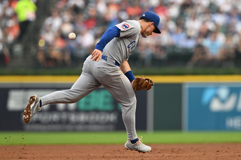 Jun 6, 2025; Detroit, Michigan, USA;  Chicago Cubs third baseman Matt Shaw (6) can’t glove a ground ball off the bat of Detroit Tigers shortstop Javier Baez (not pictured) who was given a hit on the play in the fifth inning at Comerica Park. Mandatory Credit: Lon Horwedel-Imagn Images
