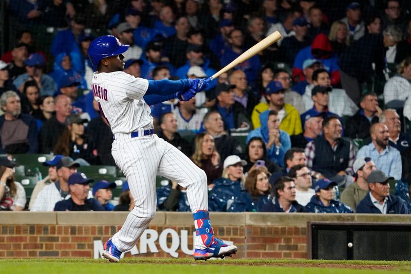 Sep 19, 2023; Chicago, Illinois, USA; Chicago Cubs first baseman Alexander Canario (4) gets his first MLB hit a one run double against the Pittsburgh Pirates during the sixth inning at Wrigley Field. Mandatory Credit: David Banks-USA TODAY Sports