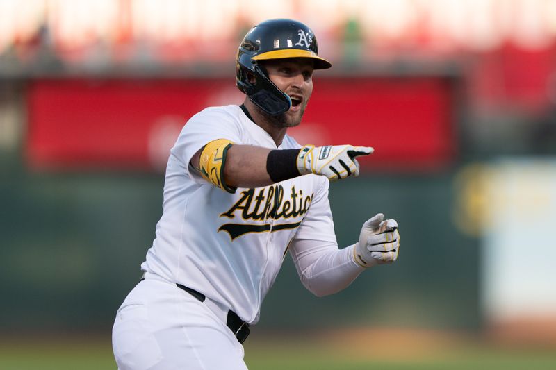 Jul 23, 2024; Oakland, California, USA;  Oakland Athletics outfielder Seth Brown (15) reacts to the dugout after hitting a solo home run during the fourth inning against the Houston Astros at Oakland-Alameda County Coliseum. Mandatory Credit: Stan Szeto-USA TODAY Sports