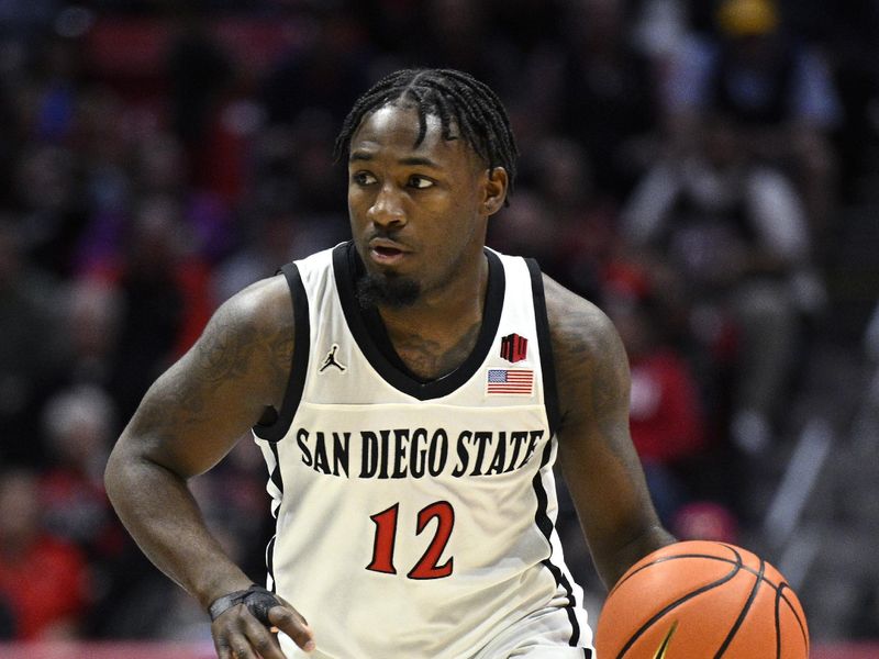 Jan 6, 2024; San Diego, California, USA; San Diego State Aztecs guard Darrion Trammell (12) dribbles the ball during the first half against the UNLV Rebels at Viejas Arena. Mandatory Credit: Orlando Ramirez-USA TODAY Sports