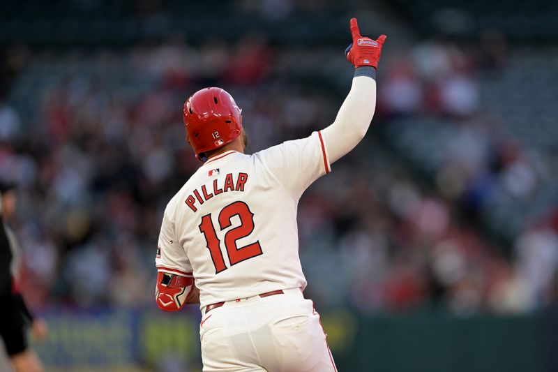 May 13, 2024; Anaheim, California, USA;   Los Angeles Angels right fielder Kevin Pillar (12) rounds the bases after hitting a three-run home run in the third inning against the St. Louis Cardinals at Angel Stadium. Mandatory Credit: Jayne Kamin-Oncea-USA TODAY Sports