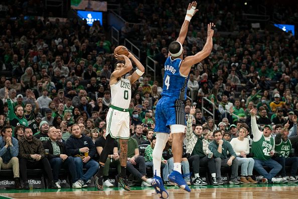 BOSTON, MASSACHUSETTS - DECEMBER 17: Jayson Tatum #0 of the Boston Celtics shoots the ball against Jalen Suggs #4 of the Orlando Magic during the second half at TD Garden on December 17, 2023 in Boston, Massachusetts. NOTE TO USER: User expressly acknowledges and agrees that, by downloading and or using this photograph, user is consenting to the terms and conditions of the Getty Images License Agreement. (Photo by Maddie Malhotra/Getty Images)