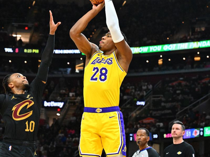 CLEVELAND, OHIO - OCTOBER 30: Rui Hachimura #28 of the Los Angeles Lakers shoots over Darius Garland #10 of the Cleveland Cavaliers during the third quarter at Rocket Mortgage Fieldhouse on October 30, 2024 in Cleveland, Ohio. The Cavaliers defeated the Lakers 134-110. NOTE TO USER: User expressly acknowledges and agrees that, by downloading and or using this photograph, User is consenting to the terms and conditions of the Getty Images License Agreement. (Photo by Jason Miller/Getty Images)