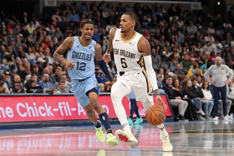 MEMPHIS, TENNESSEE - NOVEMBER 29: Dejounte Murray #5 of the New Orleans Pelicans drives to the basket against Ja Morant #12 of the Memphis Grizzlies during the second half of an Emirates NBA Cup game at FedExForum on November 29, 2024 in Memphis, Tennessee. NOTE TO USER: User expressly acknowledges and agrees that, by downloading and or using this photograph, User is consenting to the terms and conditions of the Getty Images License Agreement. (Photo by Justin Ford/Getty Images)