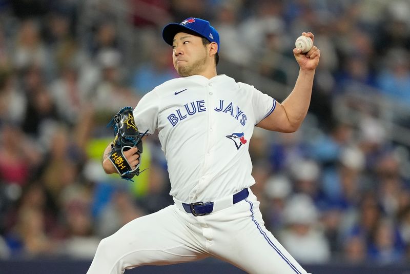 May 10, 2024; Toronto, Ontario, CAN; Toronto Blue Jays starting pitcher Yusei Kikuchi (16) pitches to the Minnesota Twins during the first inning at Rogers Centre. Mandatory Credit: John E. Sokolowski-USA TODAY Sports