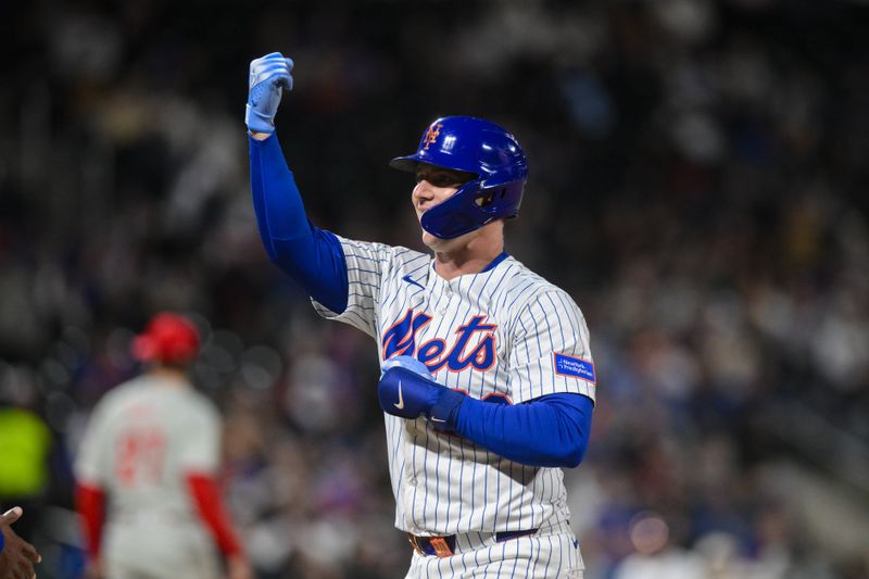 Apr 21, 2025; New York City, New York, USA; New York Mets first baseman Pete Alonso (20) reacts after hitting a single against the Philadelphia Phillies during the sixth inning at Citi Field. Mandatory Credit: John Jones-Imagn Images