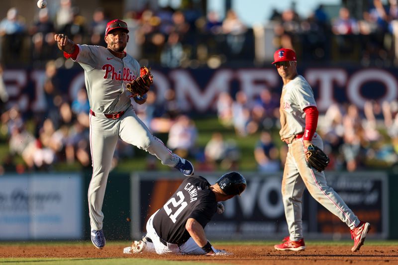 Mar 19, 2024; Lakeland, Florida, USA;  Philadelphia Phillies shortstop Edmundo Sosa (33) turns a double play against the Detroit Tigers in the second inning at Publix Field at Joker Marchant Stadium. Mandatory Credit: Nathan Ray Seebeck-USA TODAY Sports