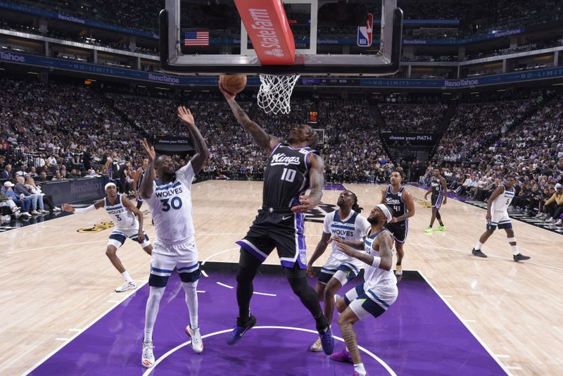 SACRAMENTO, CA - OCTOBER 24: DeMar DeRozan #10 of the Sacramento Kings drives to the basket during the game against the Minnesota Timberwolves on October 24, 2024 at Golden 1 Center in Sacramento, California. NOTE TO USER: User expressly acknowledges and agrees that, by downloading and or using this Photograph, user is consenting to the terms and conditions of the Getty Images License Agreement. Mandatory Copyright Notice: Copyright 2024 NBAE (Photo by Rocky Widner/NBAE via Getty Images)