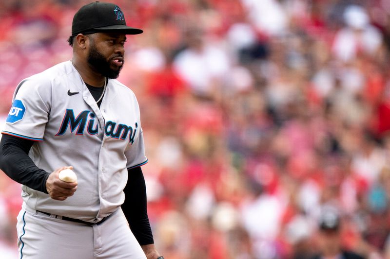 Aug 9, 2023; Cincinnati, OH, USA; Miami Marlins starting pitcher Johnny Cueto (47) prepares to pitch in the first inning of the MLB baseball game between Cincinnati Reds and Miami Marlins at Great American Ball Park in Cincinnati on Wednesday, Aug. 9, 2023.  Mandatory Credit: Albert Cesare-USA TODAY Sports