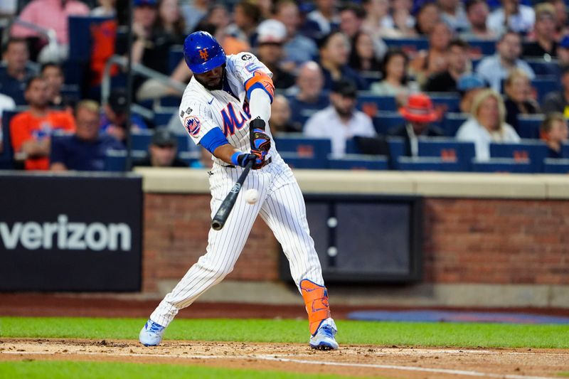 Aug 19, 2024; New York City, New York, USA; New York Mets right fielder Starling Marte (6) hits a single against the Baltimore Orioles during the first inning at Citi Field. Mandatory Credit: Gregory Fisher-USA TODAY Sports