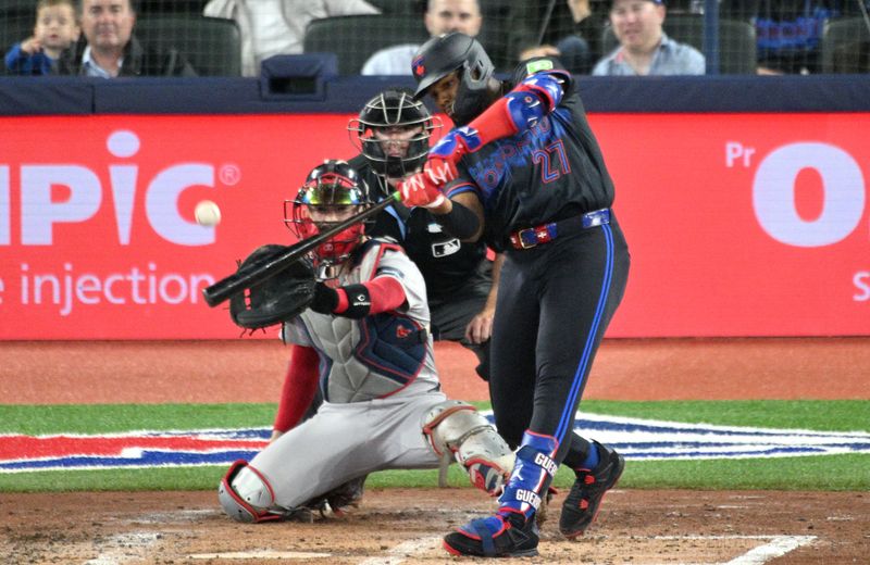 Sep 25, 2024; Toronto, Ontario, CAN;  Toronto Blue Jays first baseman Vladimir Guerrero Jr. (27) hits a double against the Boston Red Sox in the fourth inning at Rogers Centre. Mandatory Credit: Dan Hamilton-Imagn Images