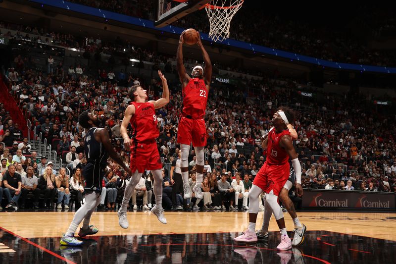 MIAMI, FL - NOVEMBER 24: Jimmy Butler #22 of the Miami Heat goes up for the rebound during the game against the Dallas Mavericks on November 24, 2024 at Kaseya Center in Miami, Florida. NOTE TO USER: User expressly acknowledges and agrees that, by downloading and or using this Photograph, user is consenting to the terms and conditions of the Getty Images License Agreement. Mandatory Copyright Notice: Copyright 2024 NBAE (Photo by Issac Baldizon/NBAE via Getty Images)