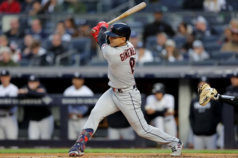 May 3, 2023; Bronx, New York, USA; Cleveland Guardians second baseman Andres Gimenez (0) follows through on an RBI single against the New York Yankees during the first inning at Yankee Stadium. Mandatory Credit: Brad Penner-USA TODAY Sports