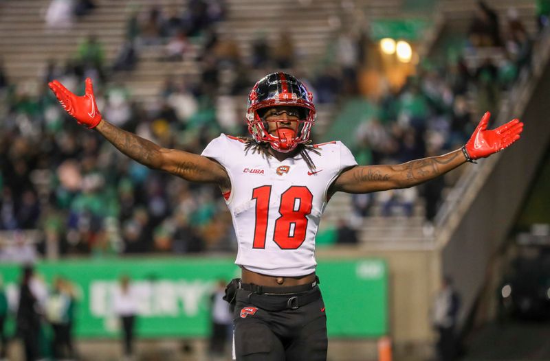 Nov 27, 2021; Huntington, West Virginia, USA; Western Kentucky Hilltoppers wide receiver Daewood Davis (18) celebrates after scoring a touchdown against the Marshall Thundering Herd during the third quarter at Joan C. Edwards Stadium. Mandatory Credit: Ben Queen-USA TODAY Sports