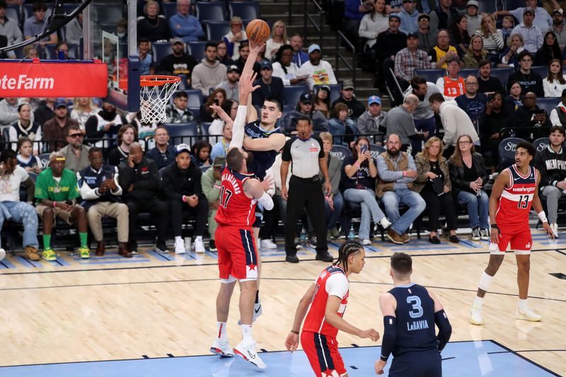 MEMPHIS, TN - NOVEMBER 8: Zach Edey #14 of the Memphis Grizzlies shoots the ball during the game against the Washington Wizards on November 8, 2024 at FedExForum in Memphis, Tennessee. NOTE TO USER: User expressly acknowledges and agrees that, by downloading and or using this photograph, User is consenting to the terms and conditions of the Getty Images License Agreement. Mandatory Copyright Notice: Copyright 2024 NBAE (Photo by Joe Murphy/NBAE via Getty Images)