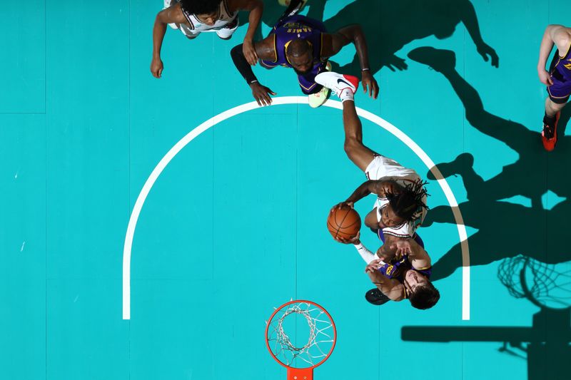 MEMPHIS, TN - NOVEMBER 6: Ja Morant #12 of the Memphis Grizzlies handles the ball during the game against the Los Angeles Lakers on November 6, 2024 at FedExForum in Memphis, Tennessee. NOTE TO USER: User expressly acknowledges and agrees that, by downloading and or using this photograph, User is consenting to the terms and conditions of the Getty Images License Agreement. Mandatory Copyright Notice: Copyright 2024 NBAE (Photo by Joe Murphy/NBAE via Getty Images)