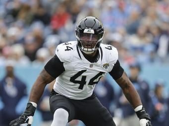 Jacksonville Jaguars defensive end Travon Walker (44) defends during the first half of an NFL football game against the Tennessee Titans, Sunday, Dec. 8, 2024, in Nashville, Tenn. (AP Photo/Stew Milne)