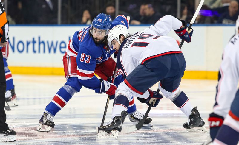 Jan 18, 2025; New York, New York, USA; New York Rangers center Mika Zibanejad (93) and Columbus Blue Jackets center Adam Fantilli (19) await the opening face-off during the first period at Madison Square Garden. Mandatory Credit: Danny Wild-Imagn Images