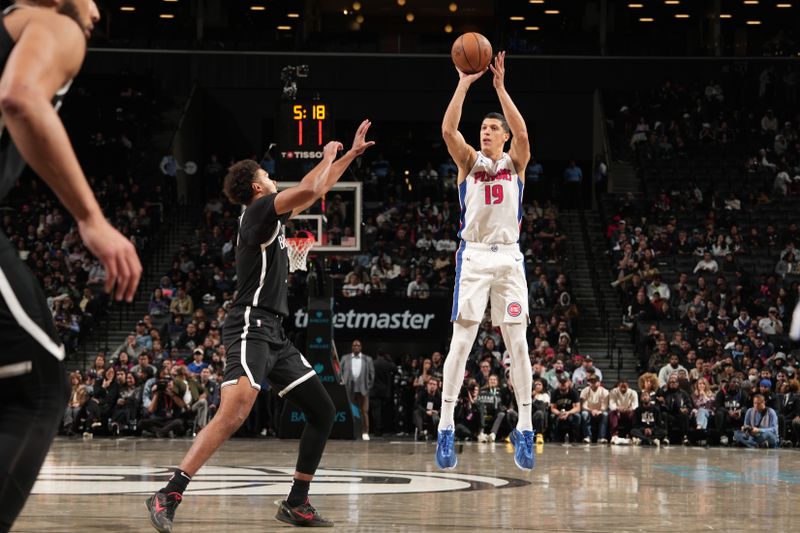 BROOKLYN, NY - NOVEMBER 3: Simone Fontecchio #19 of the Detroit Pistons shoots a three point basket during the game against the Brooklyn Nets on November 3, 2024 at Barclays Center in Brooklyn, New York. NOTE TO USER: User expressly acknowledges and agrees that, by downloading and or using this Photograph, user is consenting to the terms and conditions of the Getty Images License Agreement. Mandatory Copyright Notice: Copyright 2024 NBAE (Photo by Jesse D. Garrabrant/NBAE via Getty Images)