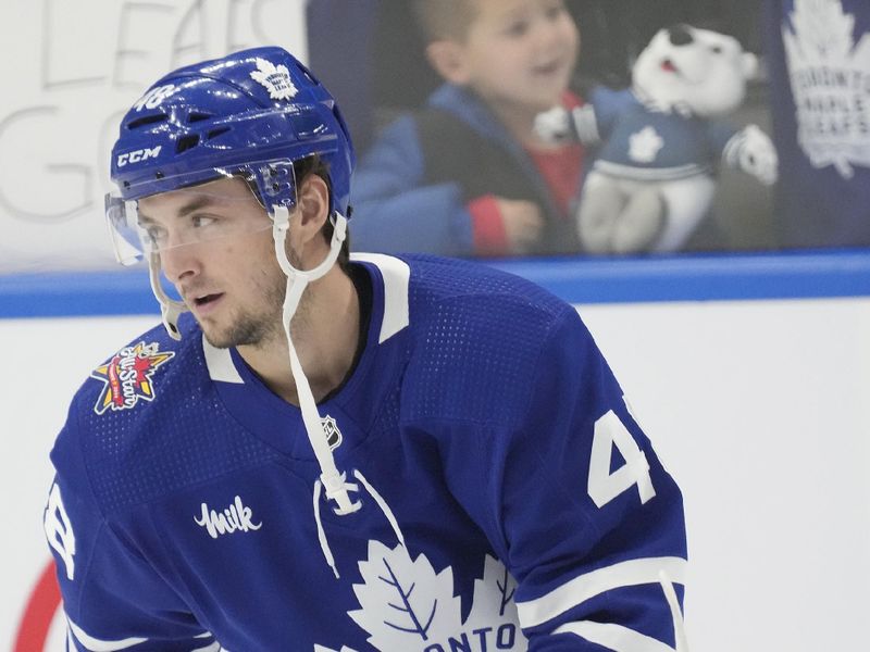 Nov 6, 2023; Toronto, Ontario, CAN; Toronto Maple Leafs defenseman Max Lajoie (48) skates during warm up before a game against the Tampa Bay Lightning at Scotiabank Arena. Mandatory Credit: John E. Sokolowski-USA TODAY Sports