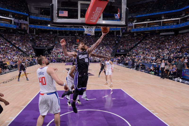 SACRAMENTO, CA - APRIL 2:  Domantas Sabonis #10 of the Sacramento Kings goes to the basket during the game on April 2, 2024 at Golden 1 Center in Sacramento, California. NOTE TO USER: User expressly acknowledges and agrees that, by downloading and or using this Photograph, user is consenting to the terms and conditions of the Getty Images License Agreement. Mandatory Copyright Notice: Copyright 2024 NBAE (Photo by Rocky Widner/NBAE via Getty Images)