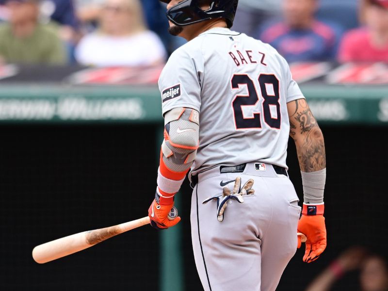 Jul 25, 2024; Cleveland, Ohio, USA; Detroit Tigers shortstop Javier Baez (28) hits a home run during the second inning against the Cleveland Guardians at Progressive Field. Mandatory Credit: Ken Blaze-USA TODAY Sports