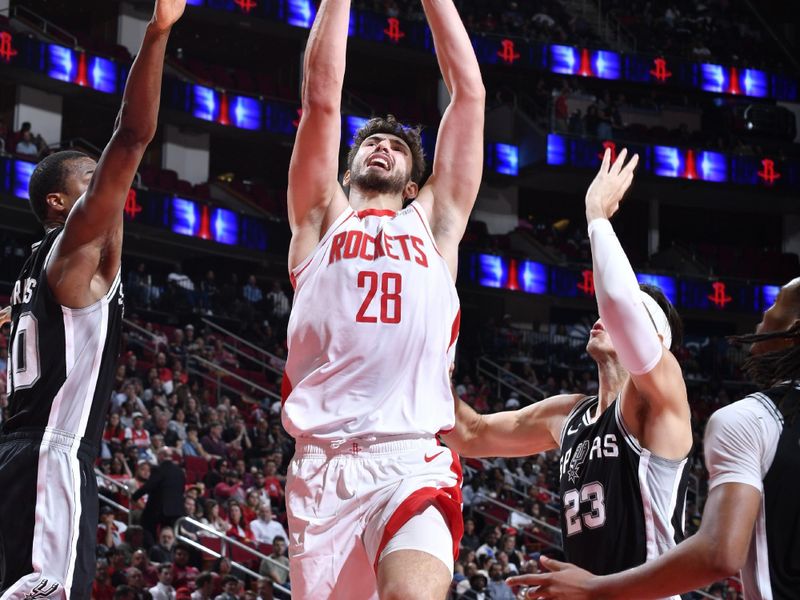 HOUSTON, TX - NOVEMBER 6:  Alperen Sengun #28 of the Houston Rockets drives to the basket during the game against the San Antonio Spurs on November 6, 2024 at the Toyota Center in Houston, Texas. NOTE TO USER: User expressly acknowledges and agrees that, by downloading and or using this photograph, User is consenting to the terms and conditions of the Getty Images License Agreement. Mandatory Copyright Notice: Copyright 2024 NBAE (Photo by Logan Riely/NBAE via Getty Images)