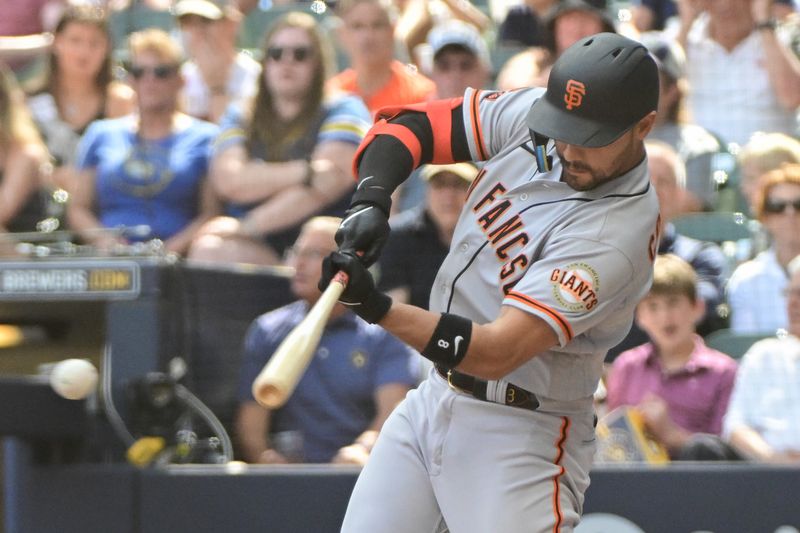 May 28, 2023; Milwaukee, Wisconsin, USA;  San Francisco Giants right fielder Michael Conforto (8) hits a single against the Milwaukee Brewers in the eighth inning at American Family Field. Mandatory Credit: Benny Sieu-USA TODAY Sports