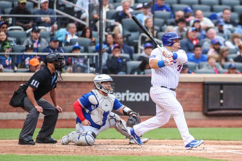 Jun 3, 2023; New York City, New York, USA;  New York Mets designated hitter Daniel Vogelbach (32) hits an RBI double in the second inning against the Toronto Blue Jays at Citi Field. Mandatory Credit: Wendell Cruz-USA TODAY Sports