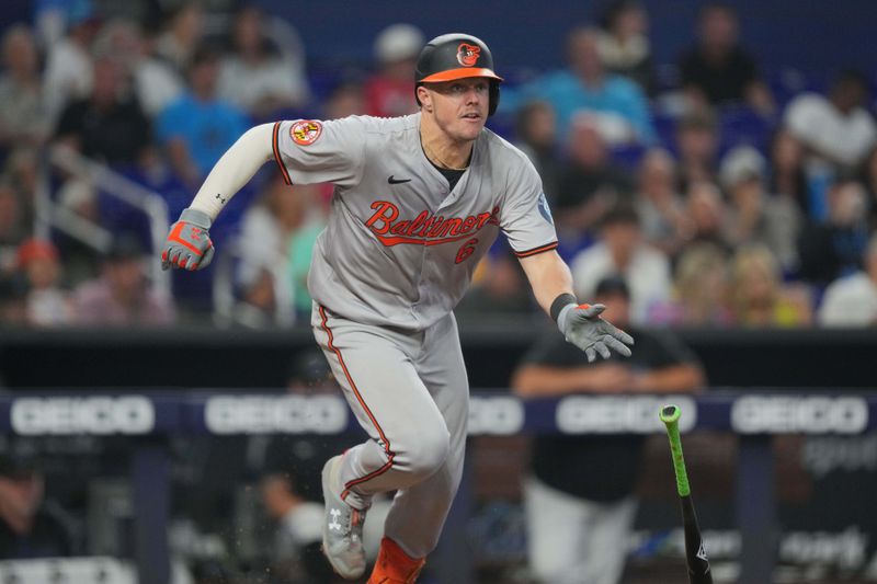 Jul 25, 2024; Miami, Florida, USA;  Baltimore Orioles first baseman Ryan Mountcastle (6) hits a double against the Miami Marlins in the eighth inning at loanDepot Park. Mandatory Credit: Jim Rassol-USA TODAY Sports