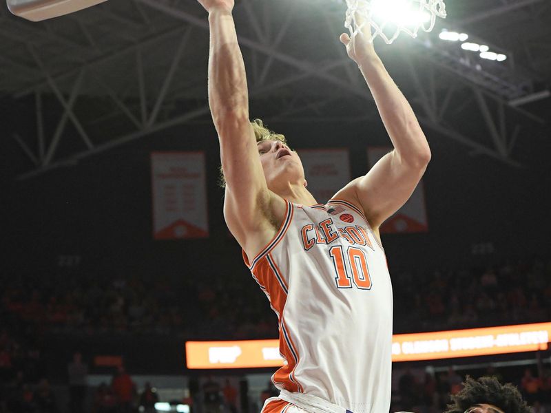 Feb 4, 2023; Clemson, South Carolina, USA; Clemson sophomore forward Ben Middlebrooks (10) scores near Miami forward Norchad Omier (15) during the second half at Littlejohn Coliseum in Clemson, S.C. Saturday, Feb. 4, 2023.  Mandatory Credit: Ken Ruinard-USA TODAY Sports