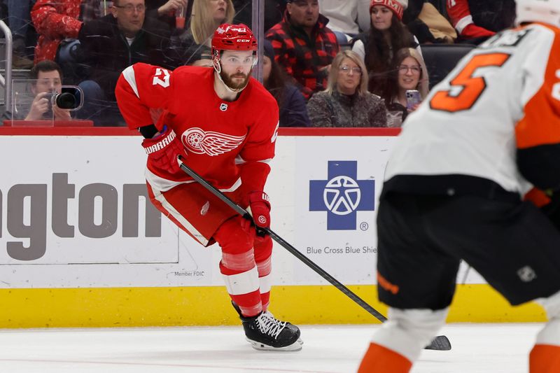 Jan 25, 2024; Detroit, Michigan, USA;  Detroit Red Wings center Michael Rasmussen (27) skates with the puck in the second period against the Philadelphia Flyers at Little Caesars Arena. Mandatory Credit: Rick Osentoski-USA TODAY Sports