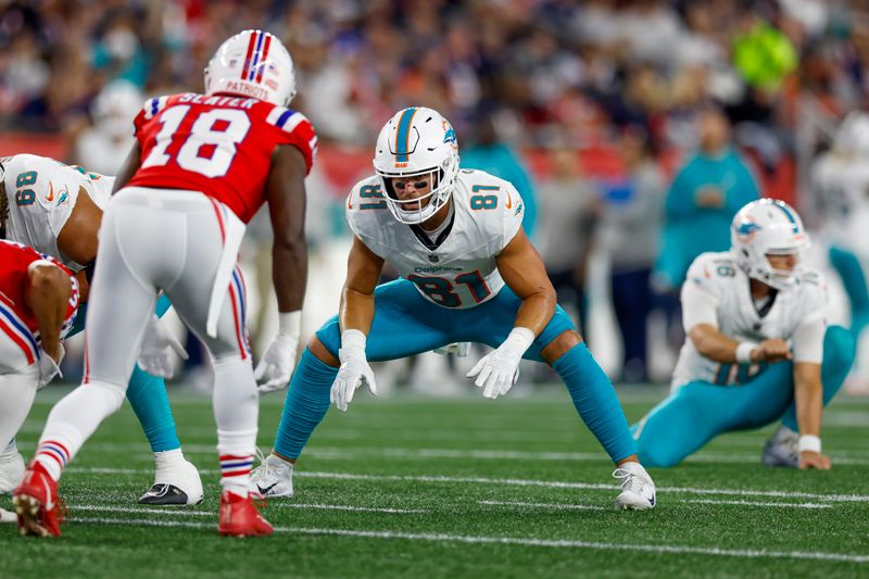 Miami Dolphins tight end Durham Smythe (81) anchors the line for an extra point attempt during the first half of an NFL football game against the New England Patriots on Sunday, Sept. 17, 2023, in Foxborough, Mass. (AP Photo/Greg M. Cooper)