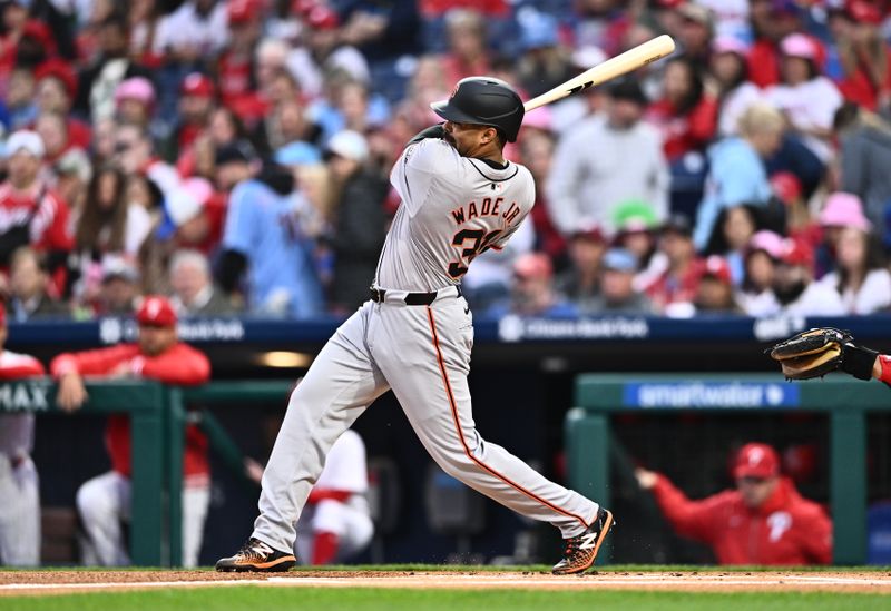 May 5, 2024; Philadelphia, Pennsylvania, USA; San Francisco Giants first baseman LaMonte Wade Jr (31) hits a single against the Philadelphia Phillies in the first inning at Citizens Bank Park. Mandatory Credit: Kyle Ross-USA TODAY Sports