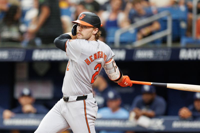 Jun 9, 2024; St. Petersburg, Florida, USA;  Baltimore Orioles shortstop Gunnar Henderson (2) doubles against the Tampa Bay Rays in the third inning at Tropicana Field. Mandatory Credit: Nathan Ray Seebeck-USA TODAY Sports