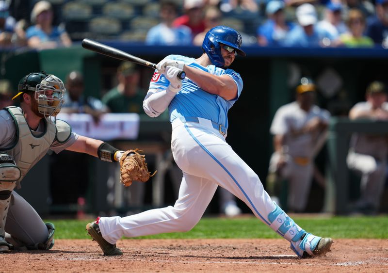 May 19, 2024; Kansas City, Missouri, USA; Kansas City Royals first baseman Vinnie Pasquantino (9) hits an RBI triple against the Oakland Athletics during the sixth inning at Kauffman Stadium. Mandatory Credit: Jay Biggerstaff-USA TODAY Sports