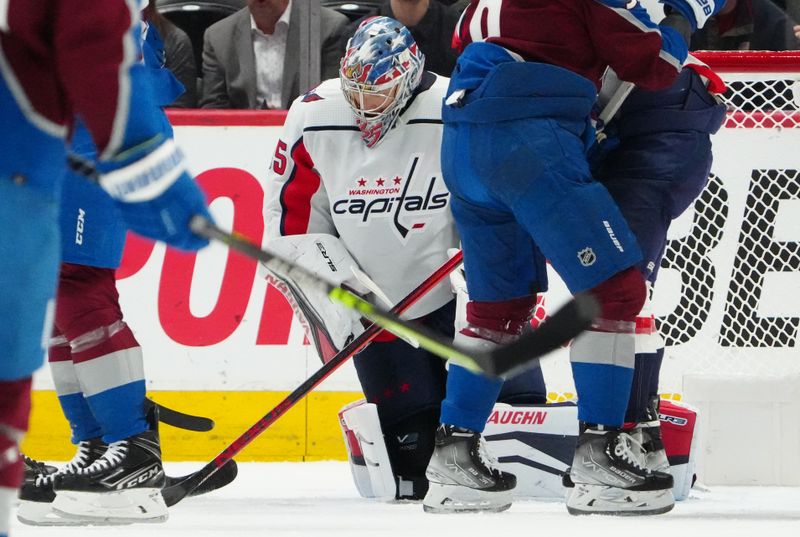 Jan 24, 2023; Denver, Colorado, USA; Washington Capitals goaltender Darcy Kuemper (35) makes a save in the first period against the Colorado Avalanche at Ball Arena. Mandatory Credit: Ron Chenoy-USA TODAY Sports