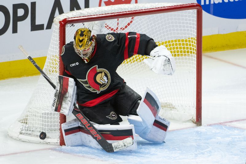 Jan 3, 2026; Ottawa, Ontario, CAN; Ottawa Senators goalie Leevi Merilainen (1) makes a save in the third period against the Winnipeg Jets at the Canadian Tire Centre. Mandatory Credit: Marc DesRosiers-IMAGN Images