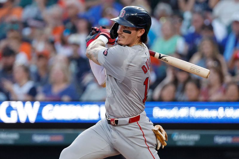 Aug 30, 2024; Detroit, Michigan, USA;  Boston Red Sox outfielder Jarren Duran (16) hits a double in the third inning against the Detroit Tigers at Comerica Park. Mandatory Credit: Rick Osentoski-USA TODAY Sports