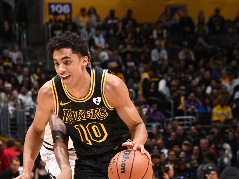 LOS ANGELES, CA - FEBRUARY 8: Max Christie #10 of the Los Angeles Lakers dribbles the ball during the game against the Denver Nuggets on Feburary 8, 2024 at Crypto.Com Arena in Los Angeles, California. NOTE TO USER: User expressly acknowledges and agrees that, by downloading and/or using this Photograph, user is consenting to the terms and conditions of the Getty Images License Agreement. Mandatory Copyright Notice: Copyright 2024 NBAE (Photo by Andrew D. Bernstein/NBAE via Getty Images)