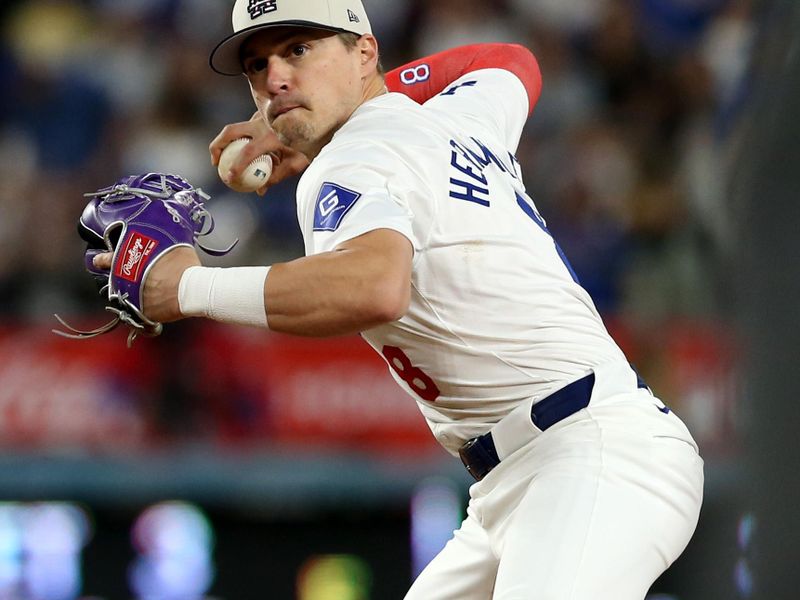Jul 4, 2024; Los Angeles, California, USA; Los Angeles Dodgers third baseman Enrique Hernandez (8) throws to first for an out during the ninth inning against the Arizona Diamondbacks at Dodger Stadium. Mandatory Credit: Jason Parkhurst-USA TODAY Sports