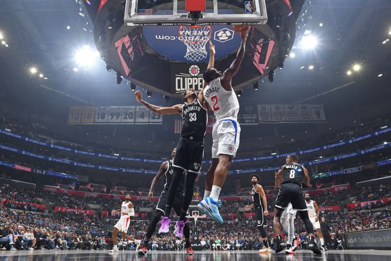 LOS ANGELES, CA - JANUARY 21: Kawhi Leonard #2 of the LA Clippers drives to the basket during the game against the Brooklyn Nets on January 21, 2024 at Crypto.Com Arena in Los Angeles, California. NOTE TO USER: User expressly acknowledges and agrees that, by downloading and/or using this Photograph, user is consenting to the terms and conditions of the Getty Images License Agreement. Mandatory Copyright Notice: Copyright 2024 NBAE (Photo by Adam Pantozzi/NBAE via Getty Images)