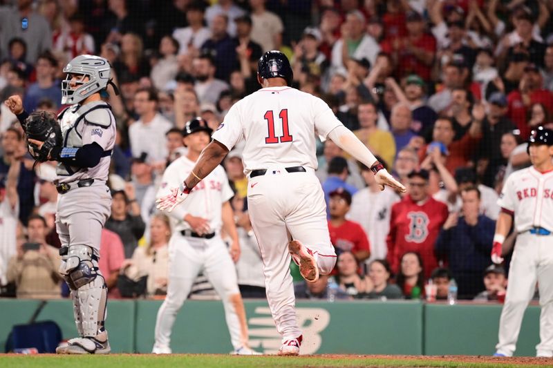 Jun 16, 2024; Boston, Massachusetts, USA; Boston Red Sox third baseman Rafael Devers (11) scores on an RBI by catcher Connor Wong (12) (not pictured) during the seventh inning against the New York Yankees at Fenway Park. Mandatory Credit: Eric Canha-USA TODAY Sports