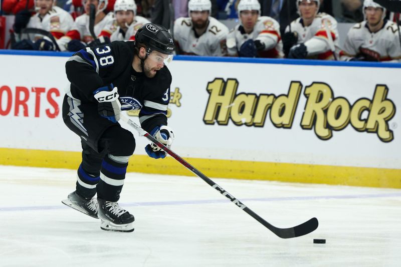 Feb 17, 2024; Tampa, Florida, USA;  Tampa Bay Lightning left wing Brandon Hagel (38) controls the puck against the Florida Panthers in the first period at Amalie Arena. Mandatory Credit: Nathan Ray Seebeck-USA TODAY Sports