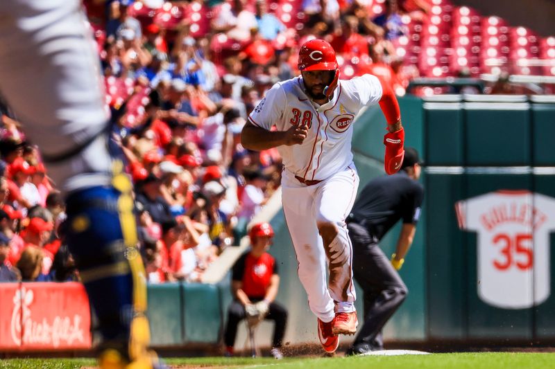 Sep 1, 2024; Cincinnati, Ohio, USA; Cincinnati Reds designated hitter Amed Rosario (38) scores on a sacrifice fly out hit by second baseman Jonathan India (not pictured) in the second inning against the Milwaukee Brewers at Great American Ball Park. Mandatory Credit: Katie Stratman-USA TODAY Sports