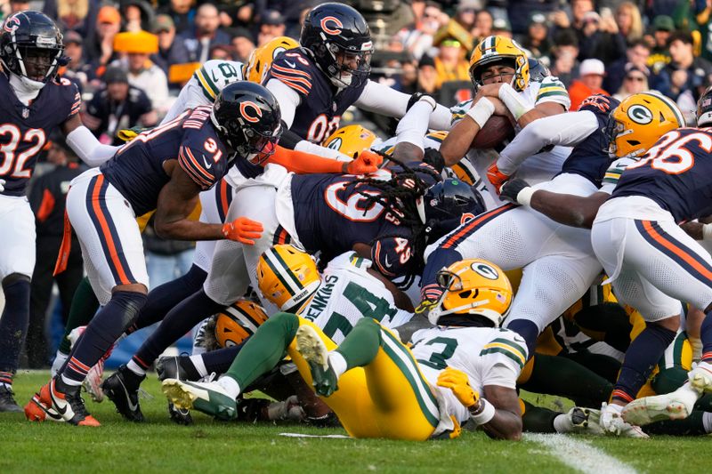 Green Bay Packers' Jordan Love scores a touchdown during the second half of an NFL football game against the Chicago Bears Sunday, Nov. 17, 2024, in Chicago. (AP Photo/Nam Y. Huh)