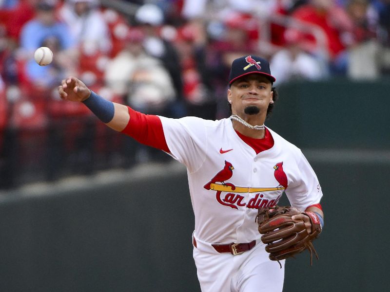 Apr 27, 2025; St. Louis, Missouri, USA;  St. Louis Cardinals shortstop Masyn Winn (0) throws to first against the Milwaukee Brewers during the third inning at Busch Stadium. Mandatory Credit: Jeff Curry-Imagn Images